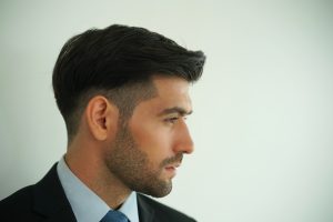 elegant young handsome man with a beard
